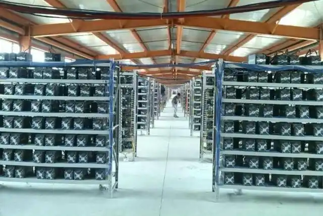 Modern mining farm with high-capacity servers hosting multiple cryptocurrency rigs
