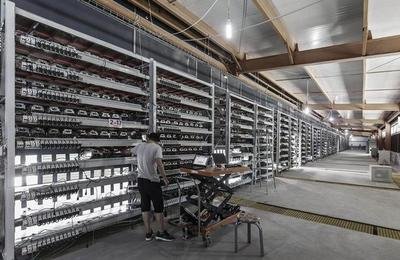 Cryptocurrency mining farm operation showing multiple mining rigs in action