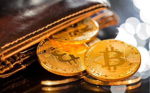 Bitcoin logo surrounded by green leaves, symbolizing green mining.